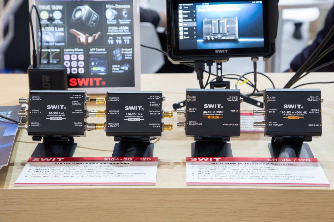 SWIT S104-3G and S104-12G SDI 1x4 distribution amplifiers and SH-3G and SH-12G bi-directional SDI to HDMI converter boxes on the IBC2026 stand