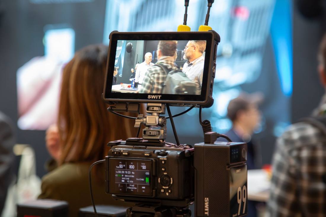 The SWIT K7 7-inch cine camera monitor with protective rubber corner guards mounted on a camera rig at IBC2026