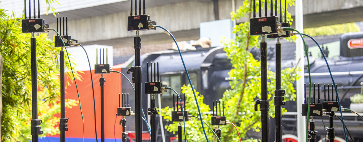 Thirteen SWIT FLOW wireless transmitters used for an outdoor flash-mob production in Shanghai